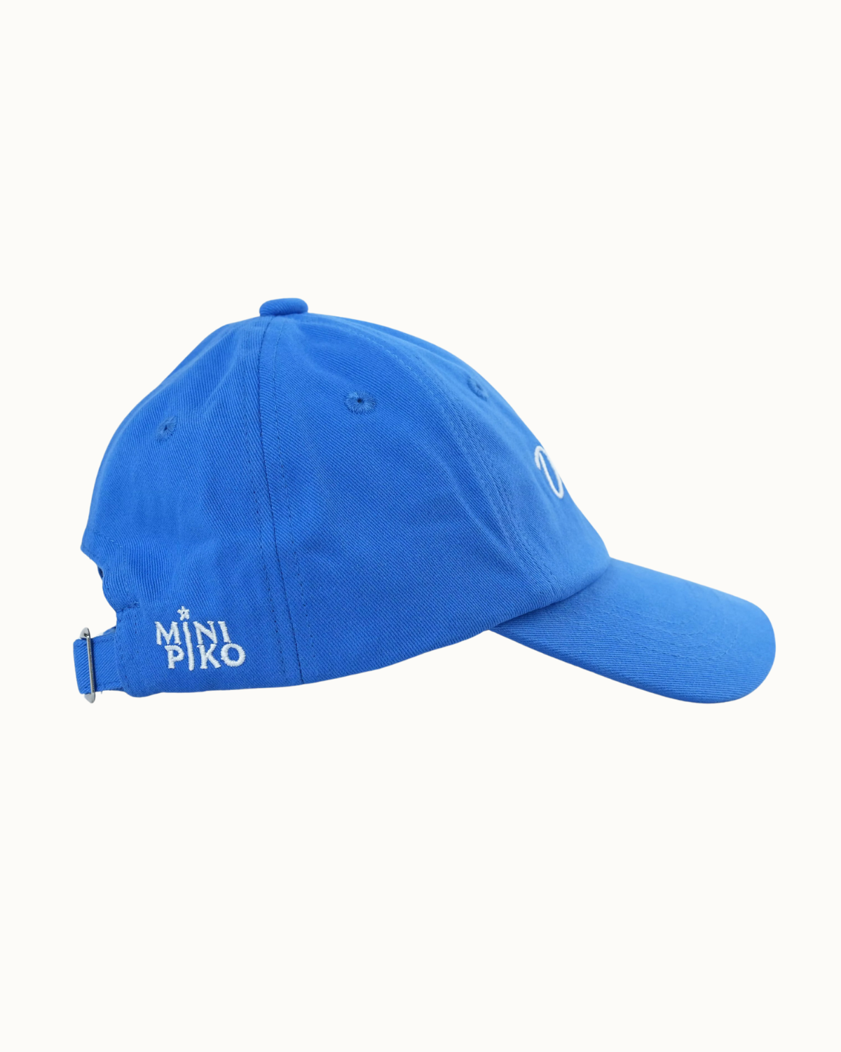 A bright blue baseball cap with a curved brim, featuring white embroidered text reading 'MINI PIKO' on the side and a small white embroidered logo on the front, set against a plain off-white background.